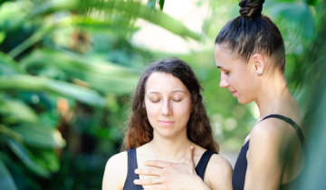 Woman guiding other woman through meditation